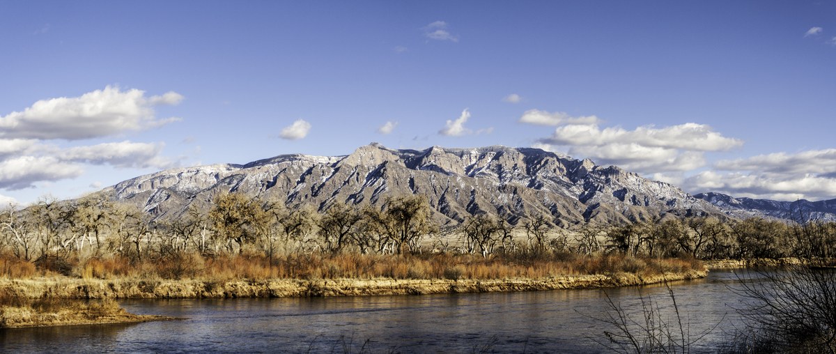 The Sandia Mountains rising above the Rio Grande near Albuquerque, New Mexico, photographed in winter